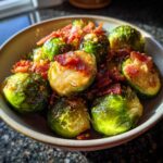 Close-up of roasted Brussels Sprouts with Bacon in a bowl, a delicious side dish.
