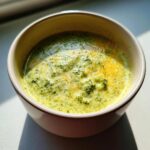 Close-up of a bowl of creamy, healthy Broccoli Cheddar Soup.