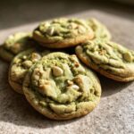 Close-up of delicious Holiday Pistachio Pudding Cookies with white chocolate chips and pistachios.