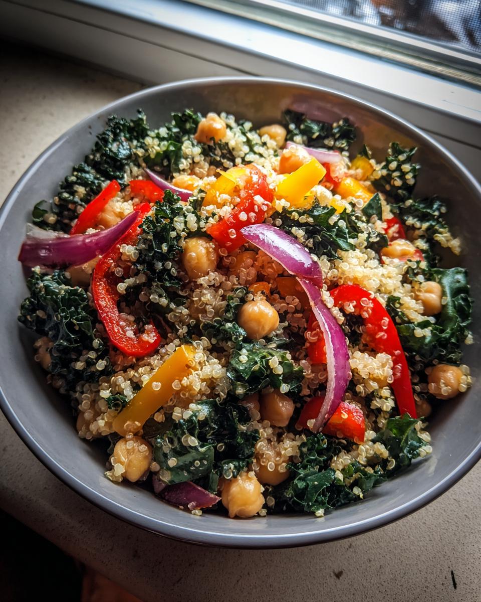 A vibrant Quinoa Kale Power Bowl with chickpeas, bell peppers, and red onion.