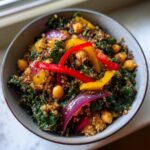 Overhead shot of a Quinoa Kale Power Bowl with chickpeas, peppers, and red onion.