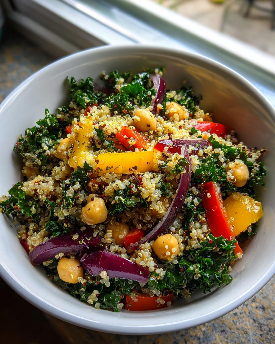 Close-up of a Quinoa Kale Power Bowl with colorful vegetables and chickpeas.