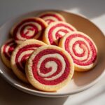 Close-up of a plate of Sweet Valentine’s Day Swirl Cookies, red and white spiral cookies.